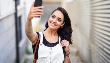 girl takes selfie on smartphone