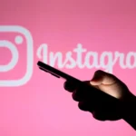 phone in hand on instagram background