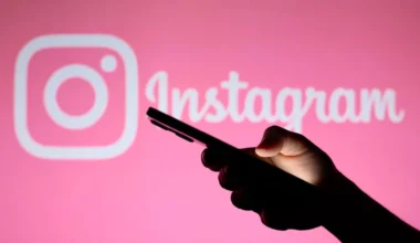 phone in hand on instagram background