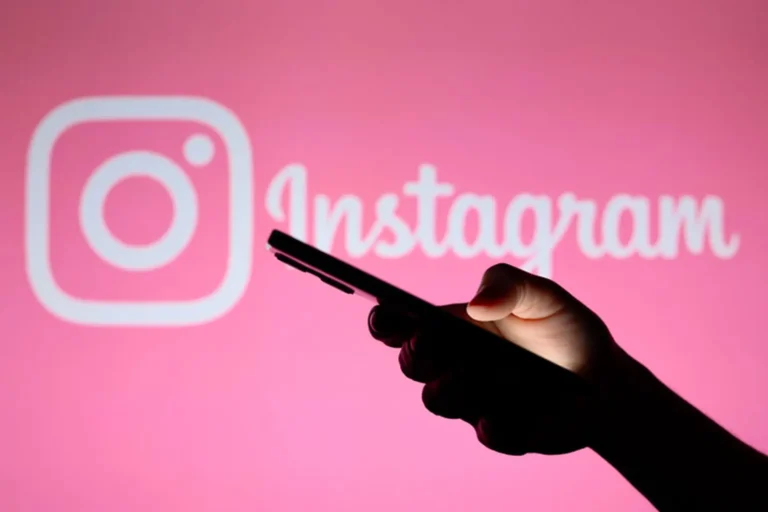 phone in hand on instagram background